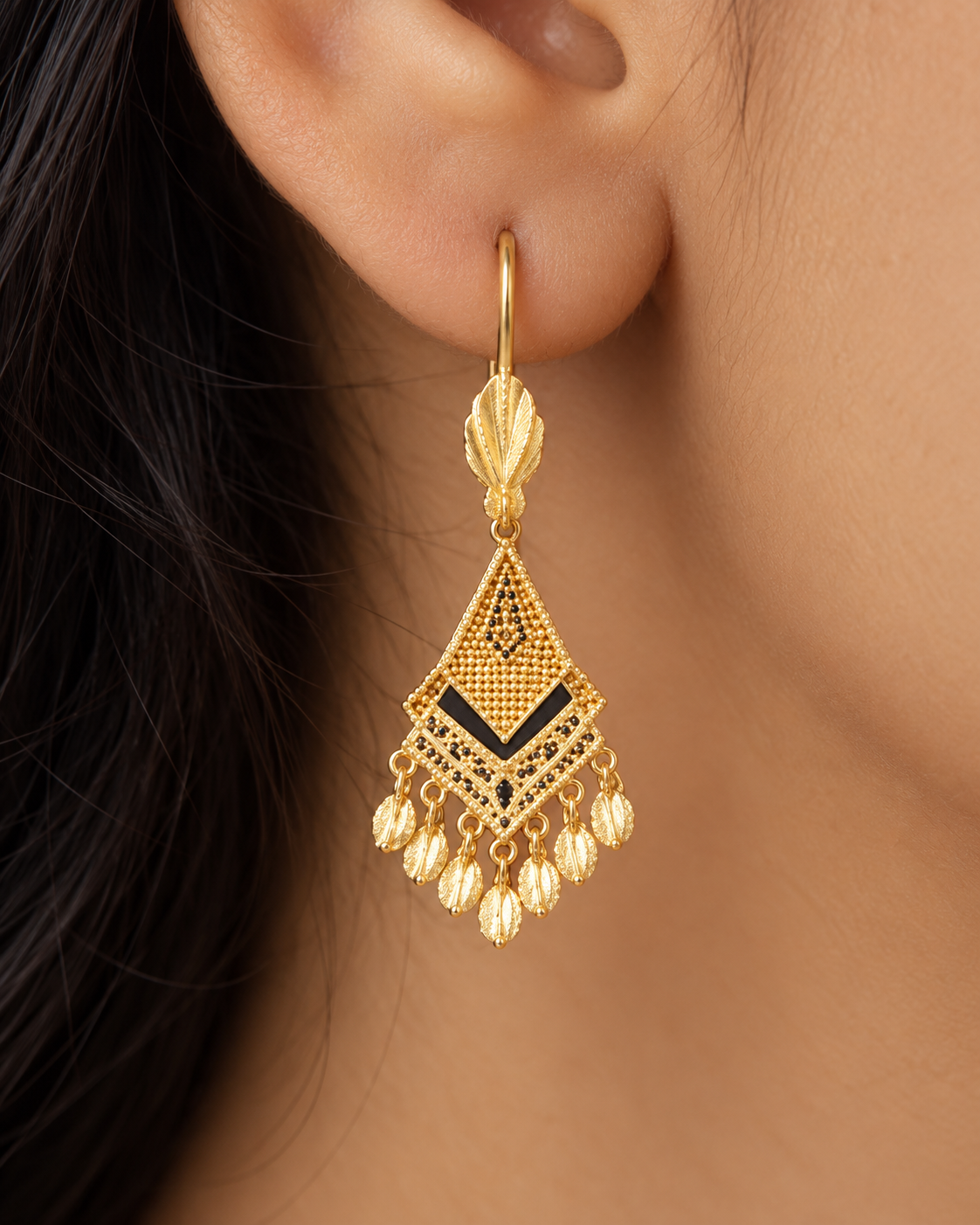 Gold kite earrings with black enamel chevron and leaf fringe