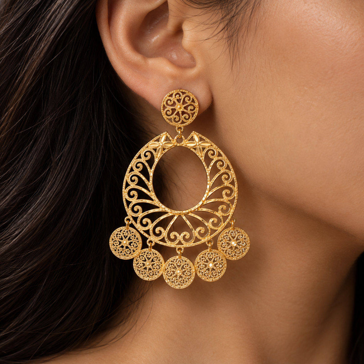 Large gold filigree scroll hoop earrings with five filigree disc charms