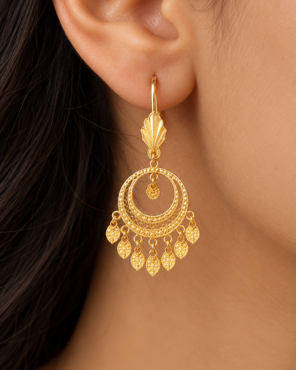 Round gold filigree halo earrings with a fringe of beaded leaves