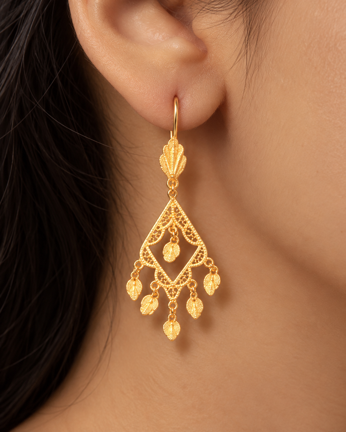 Gold filigree diamond-shaped chandelier earrings with leaf drops
