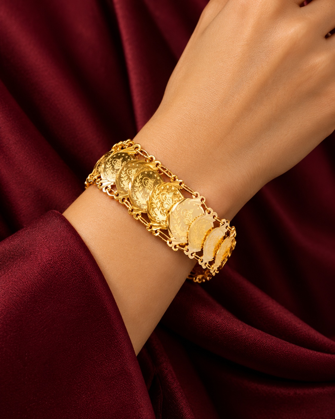 Gold bracelet of overlapping Ottoman-style coins on fancy link rails