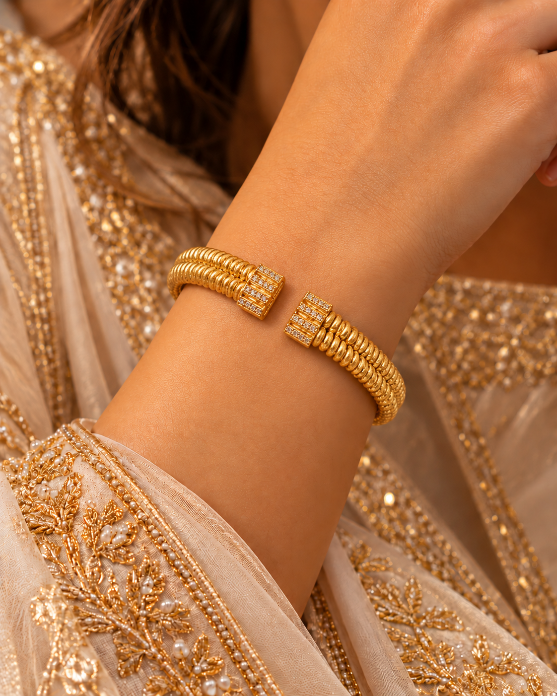Double-row coiled gold open cuff with stone-set ends