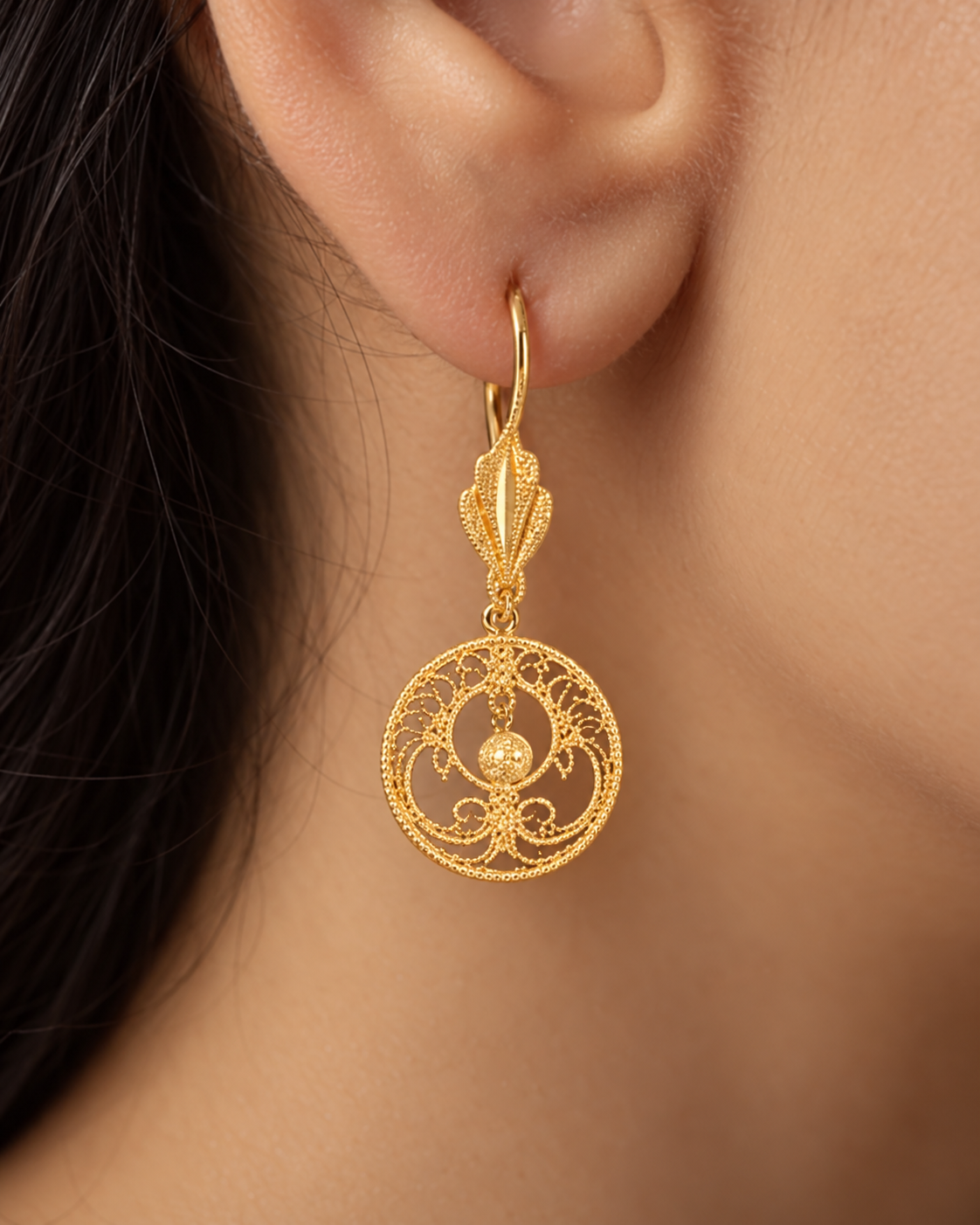 Round gold filigree drop earrings with a floating gold bead