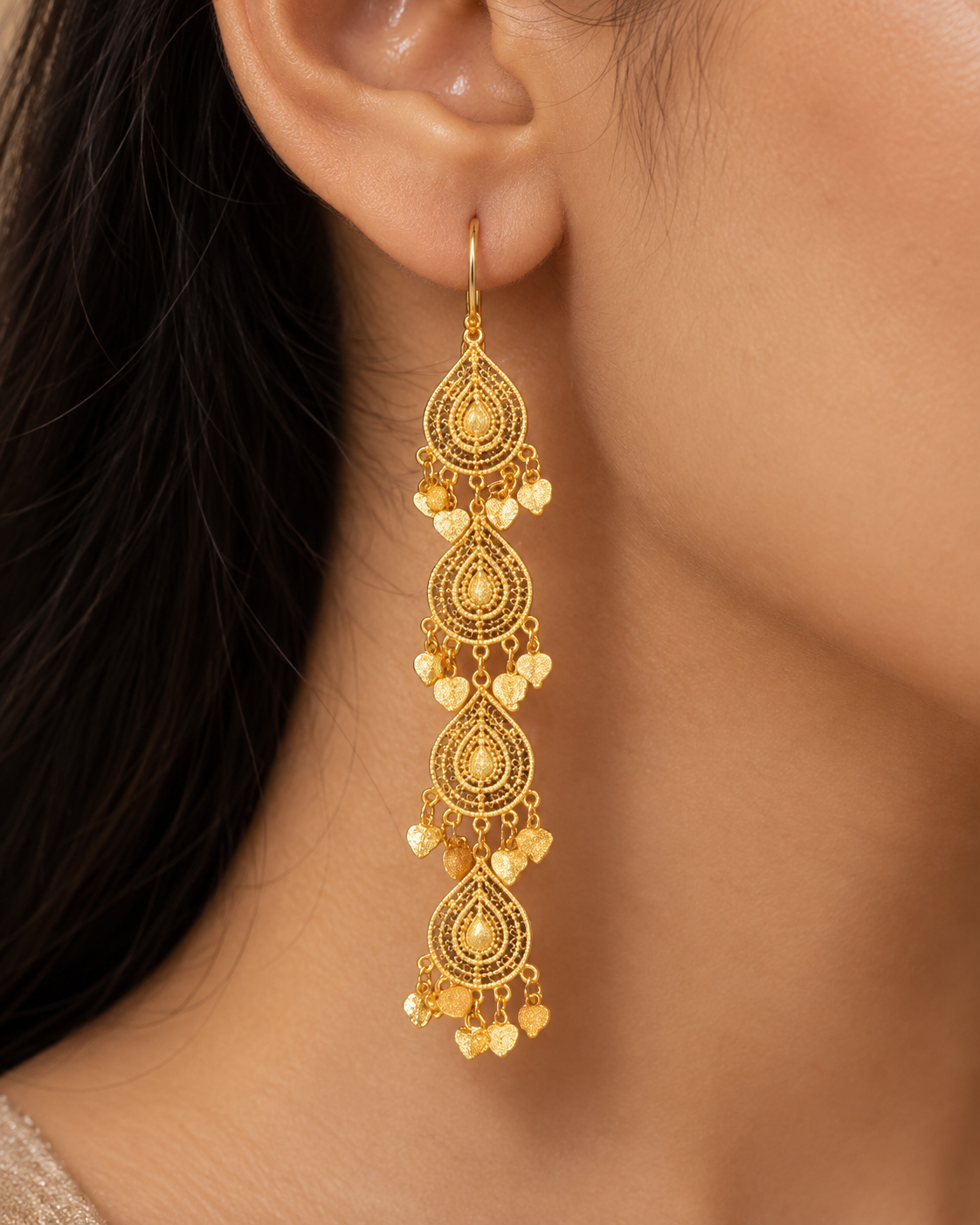 Long gold filigree teardrop cascade earrings with heart charms