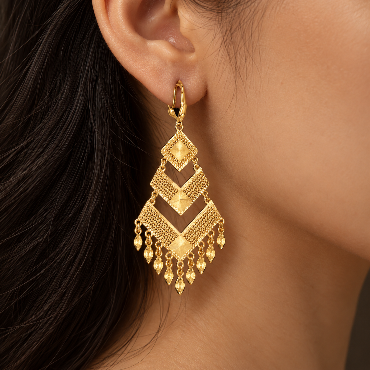 Gold mesh chevron earrings with diamond-cut sunbursts and marquise fringe