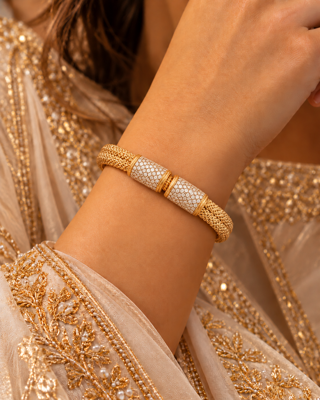 Gold woven bangle with two pavé white-stone panels